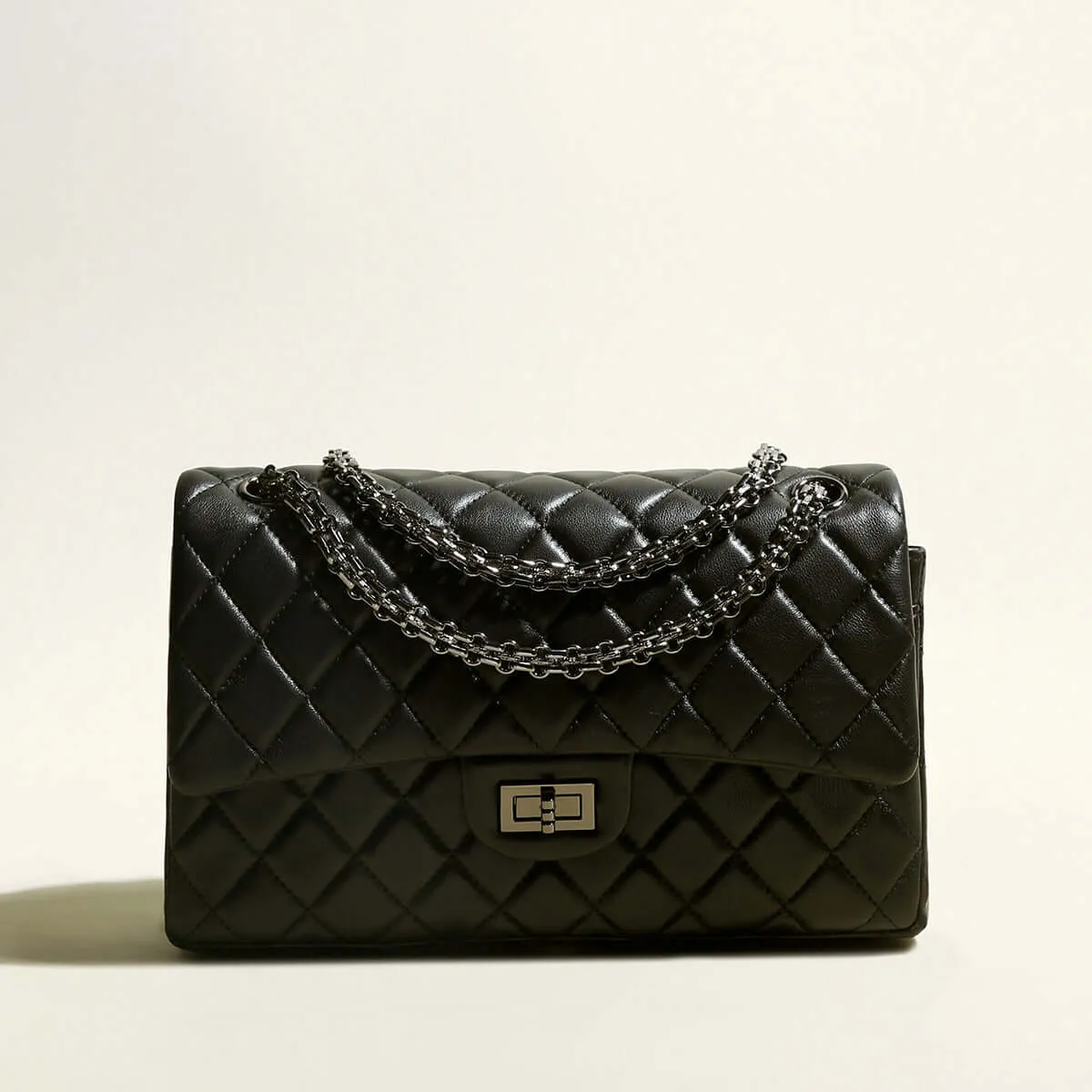 Capacious Black Quilted Bag with Metallic Chain Straps